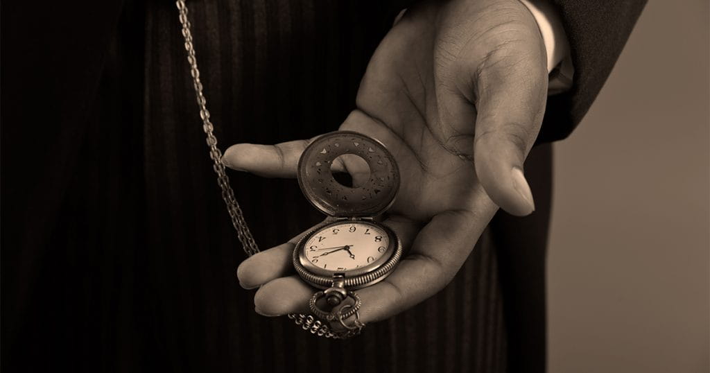 A Hand Holding a Pocket Watch